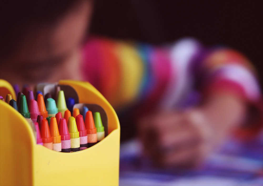 picture of child concentrating on drawing